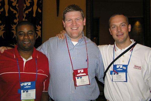 a group of men wearing lanyards