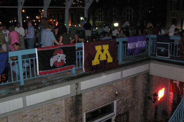 a group of people standing on a balcony