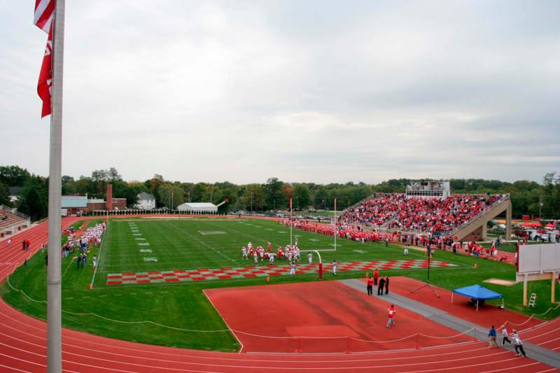 a football field with people in the stands