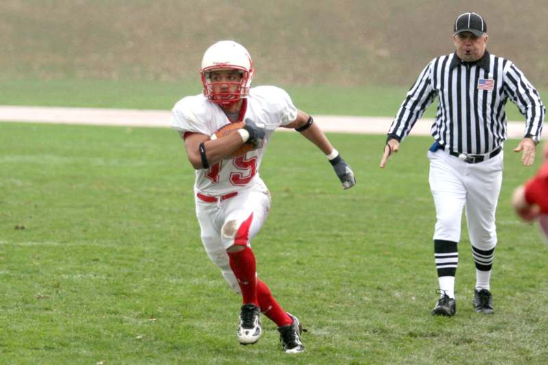 a football player running with a football