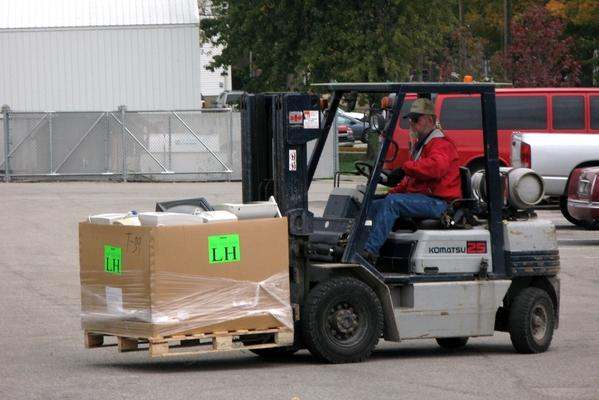 a man driving a forklift