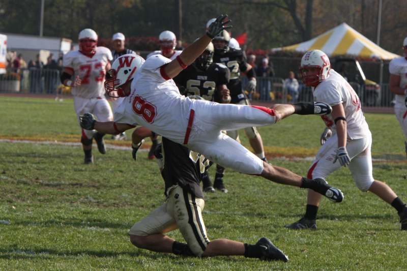 a football player falling in the air