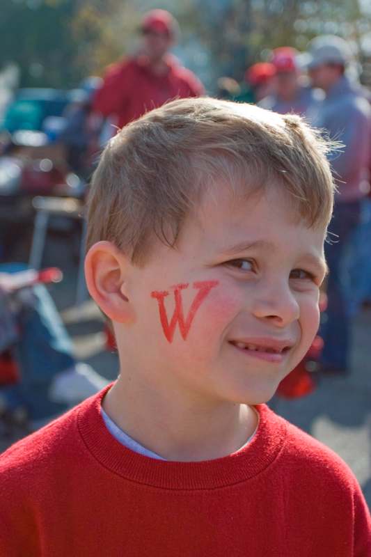 a boy with a w on his face