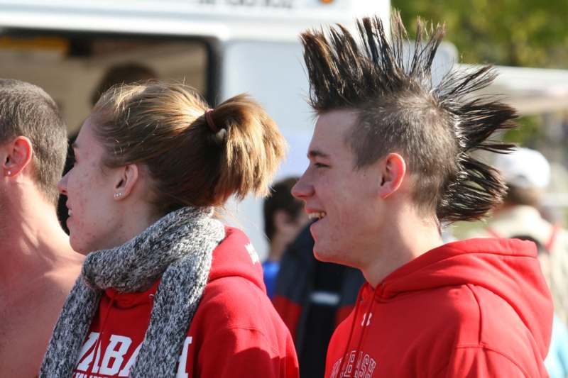 a man and woman with mohawks