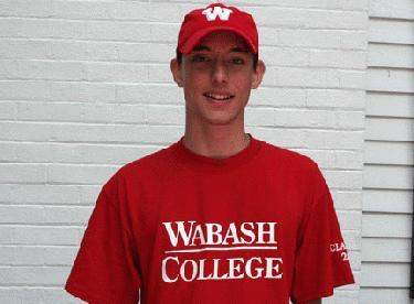 a man wearing a red shirt and a hat
