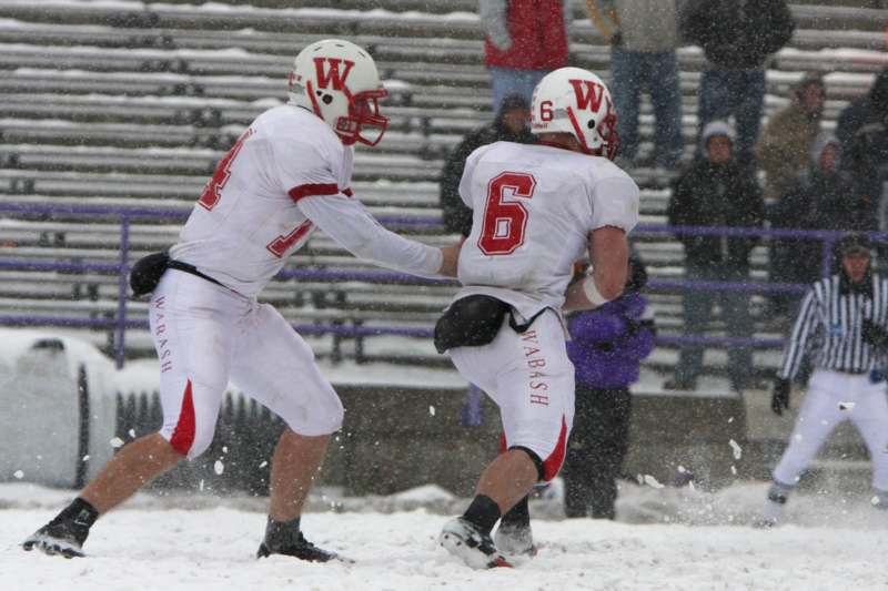 two football players in the snow