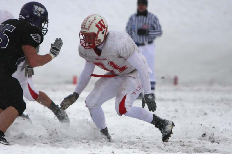 a football player running in the snow