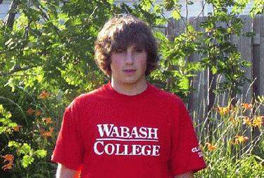 a young man in a red shirt