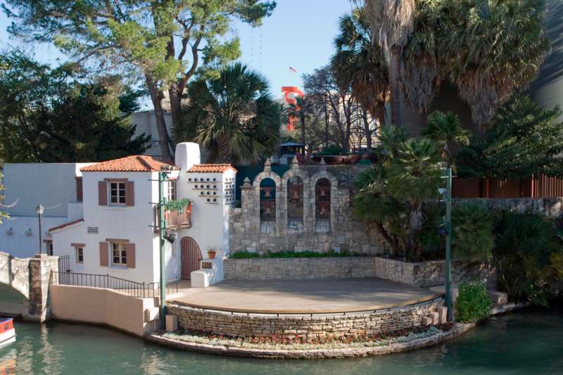 a building with a stone wall and a stone wall around it