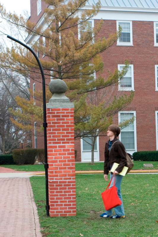 a woman walking on a sidewalk