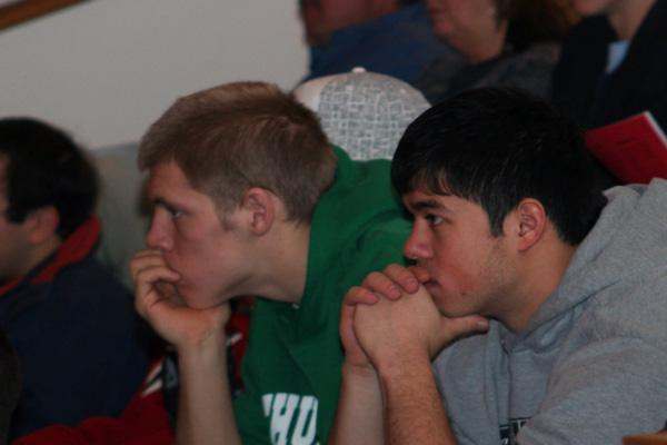 two men sitting next to each other
