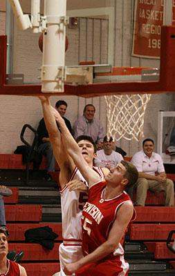 a basketball player dunking a ball