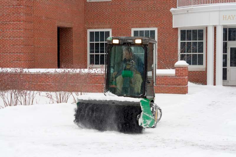 a man in a snowplow