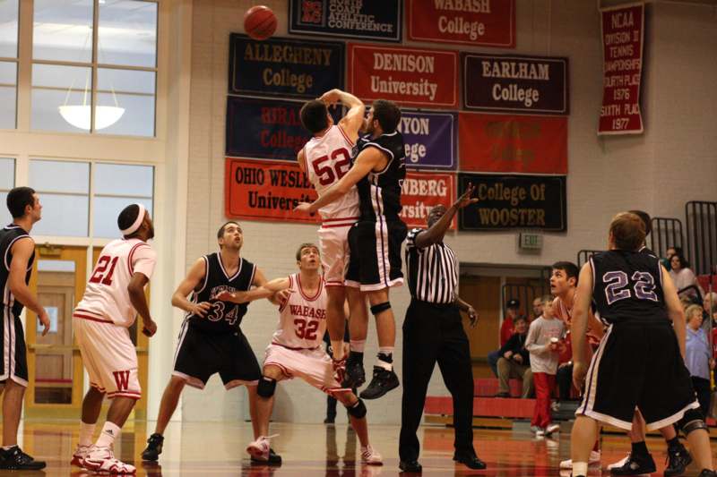 a basketball player jumping over a basketball