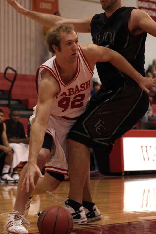 a basketball player in a uniform playing basketball