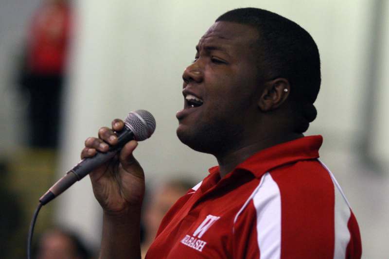 a man singing into a microphone