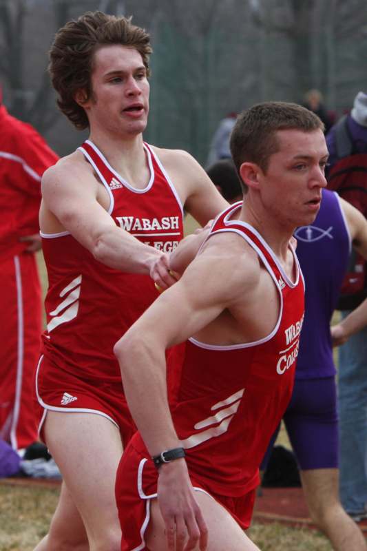 a group of men in red uniforms running