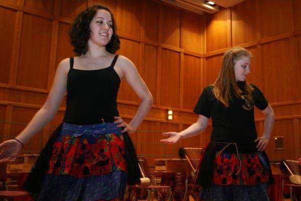 a couple of women in skirts