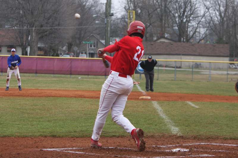 a baseball player hitting a ball