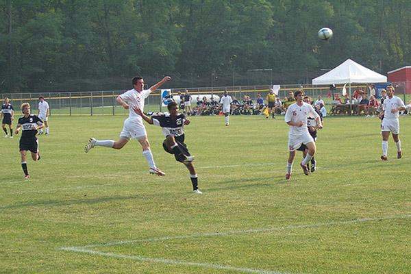 a group of men playing football