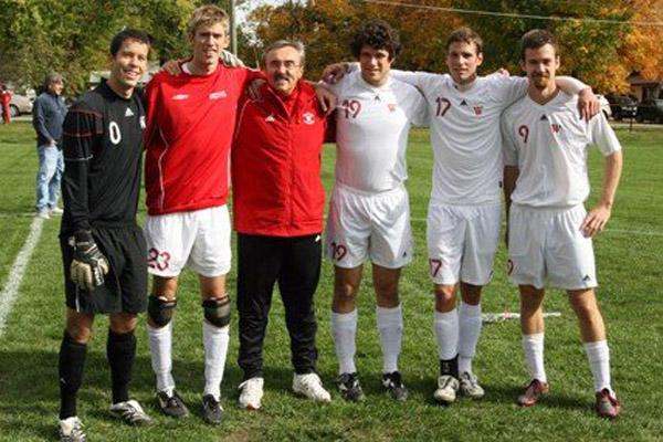 a group of men in sports uniforms