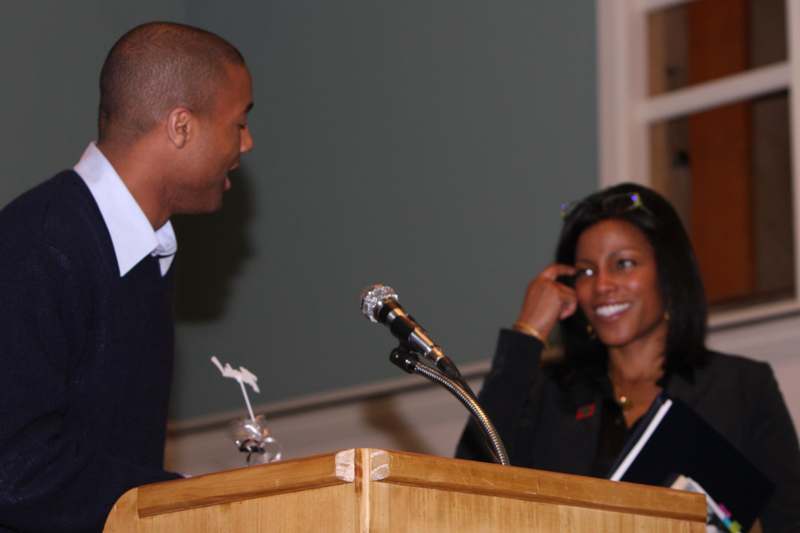 a man and woman at a podium