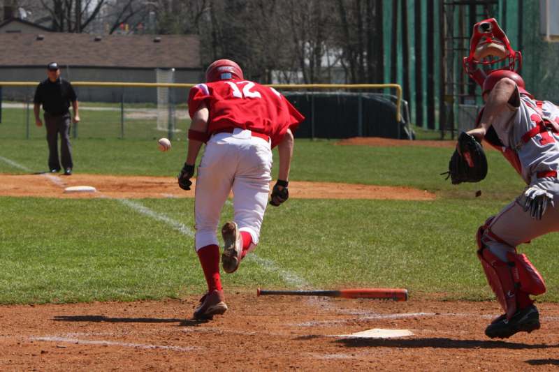 a baseball player running to catch a ball
