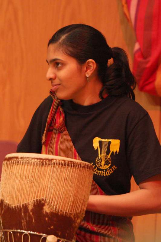 a woman with a drum