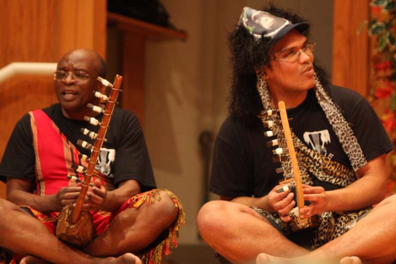 two men playing musical instruments
