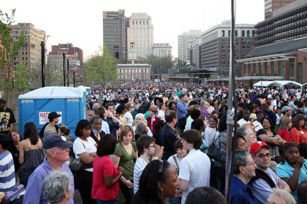 a large crowd of people in a city