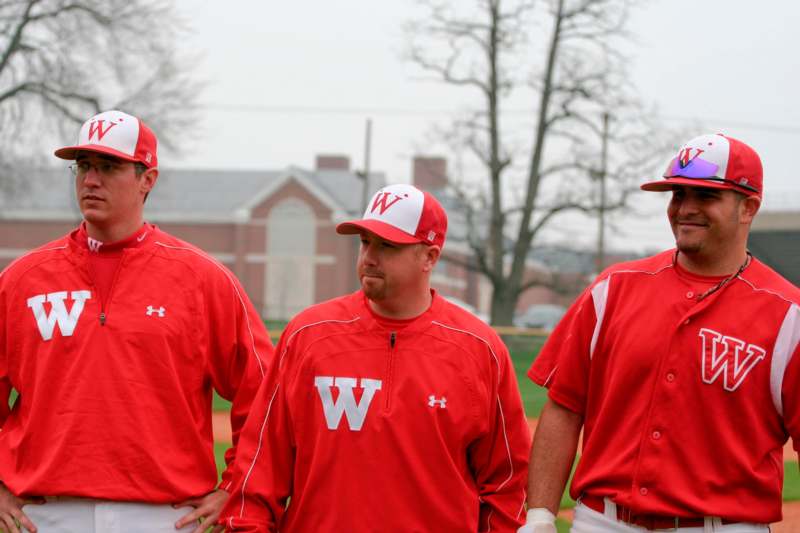 a group of men in red and white uniforms