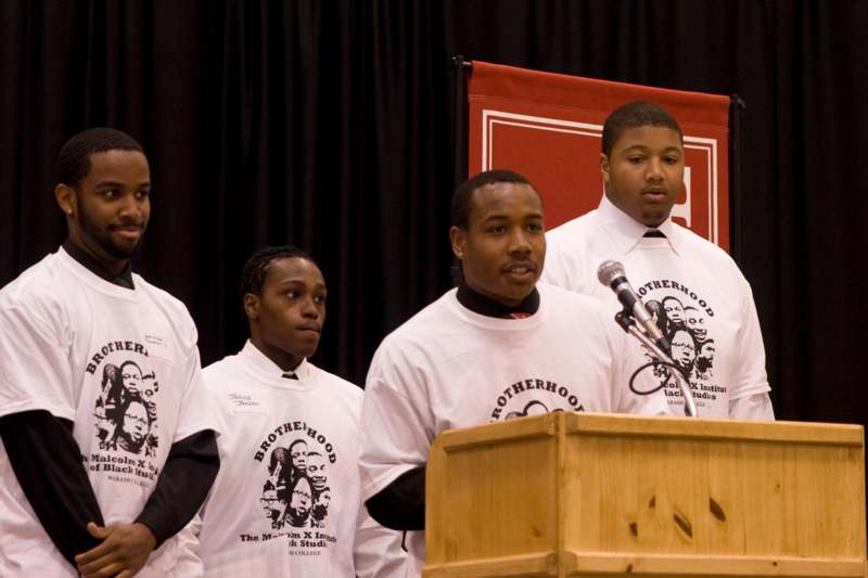 a group of young men standing at a podium