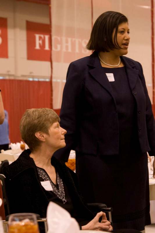 a woman standing next to a woman