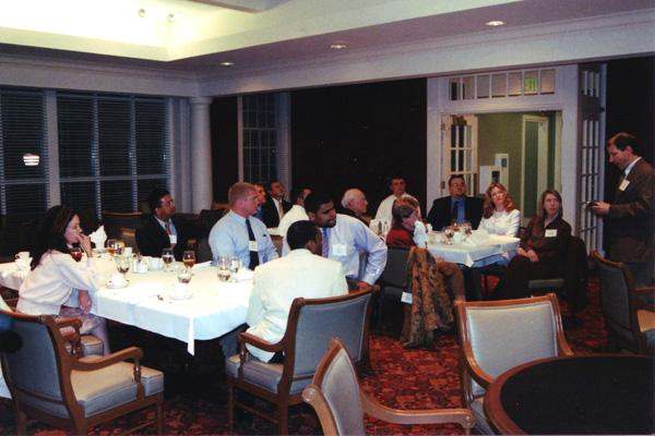 a group of people sitting around tables