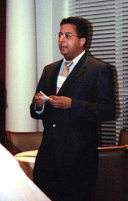 a man in a suit holding a piece of paper