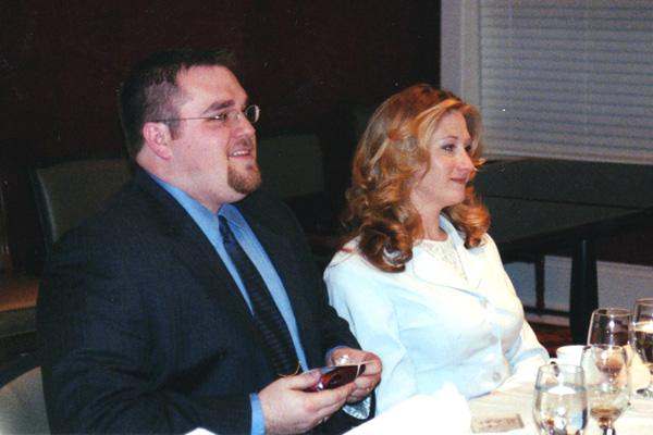 a man and woman sitting at a table