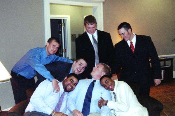 a group of men posing for a photo