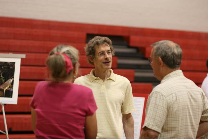 a man talking to a group of people