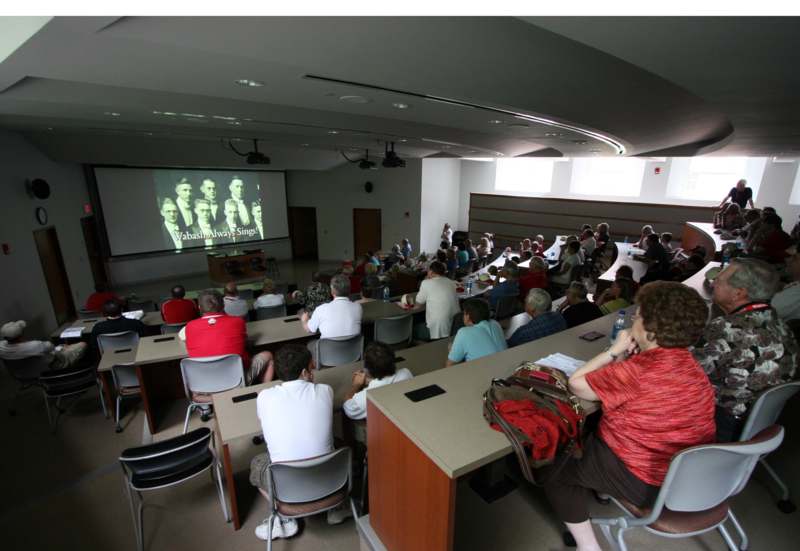a group of people in a lecture hall
