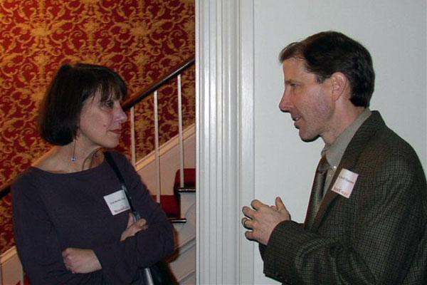 a man and woman talking to each other