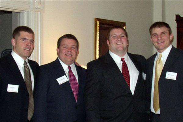 a group of men wearing suits and ties