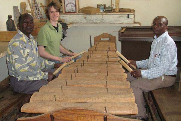 a group of men playing xylophones