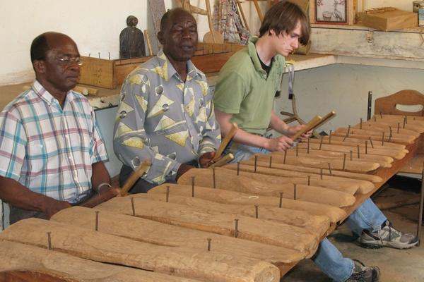 a group of men playing xylophones