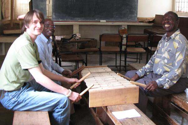 a group of men playing xylophones