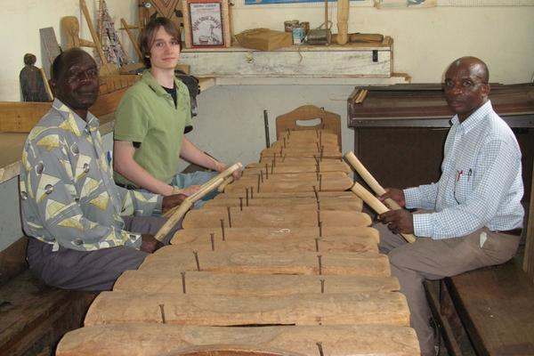 a group of men playing xylophone
