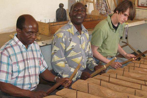 a group of men playing xylophones