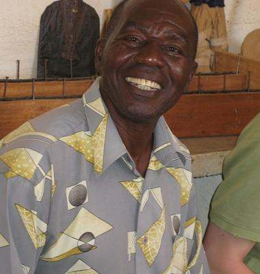 a man smiling at the camera