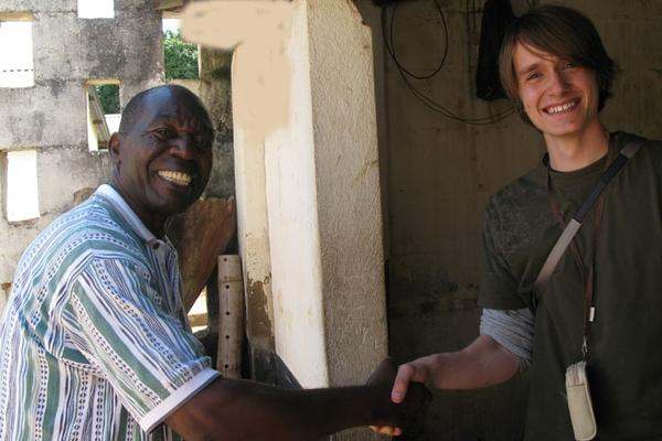 a man shaking hands with another man