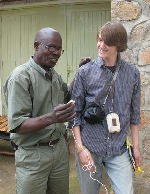 a man holding a device to another man