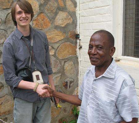 a man shaking hands with another man